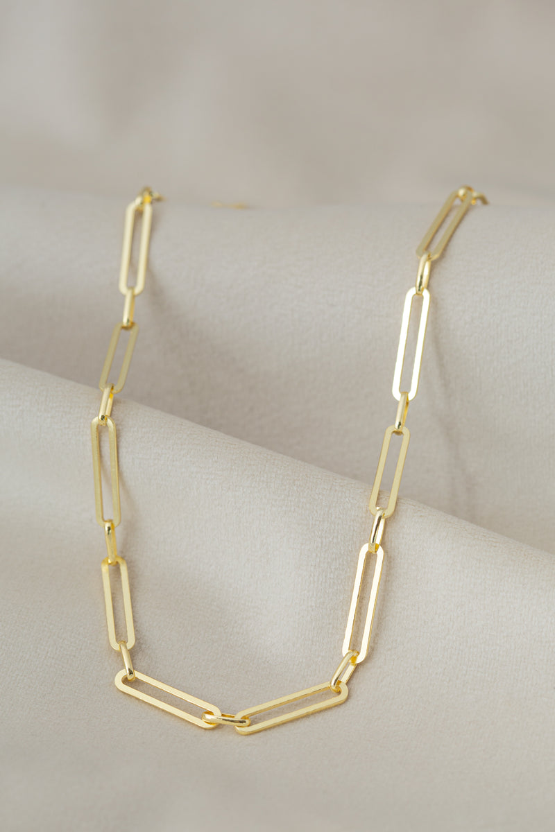 Golden chunky chain choker necklace Alex on textile