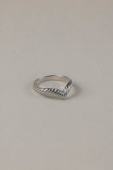 Silver knuckle ring Ada on textile