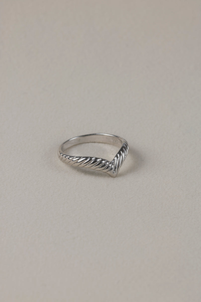 Silver knuckle ring Ada on textile